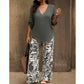 Conjunto composto por uma blusa feminina com decote em V e umas calças largas com padrões