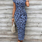 Acquis🥳2026 PROMOÇÃO ESPECIAL 50% DE DESCONTO! 🥳💞Mais de 50 mil unidades vendidas!🌸Vestido justo com nó para mulher – Estampado de leopardo, com nó que realça a barriga. Confortável e elegante para festas ou encontros à noite. Sinta-se deslumbrante.